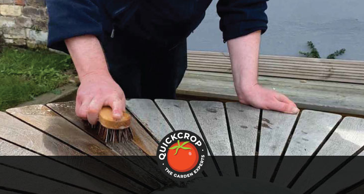 Cleaning a wooden outdoor table - header image