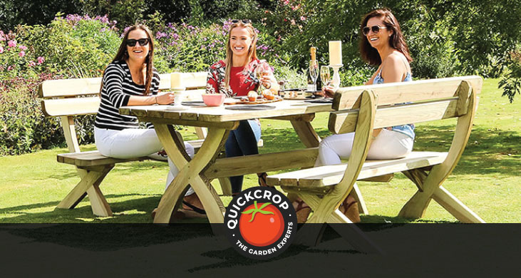 People socialising on a wooden garden bench - header image