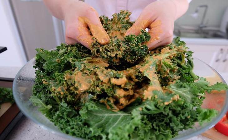 Making some kale chips, a healthy snack for children