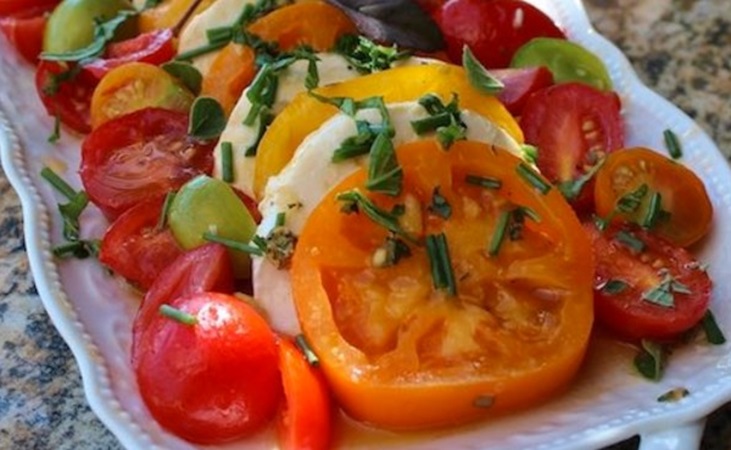 Tomato mozzarella salad on a serving dish