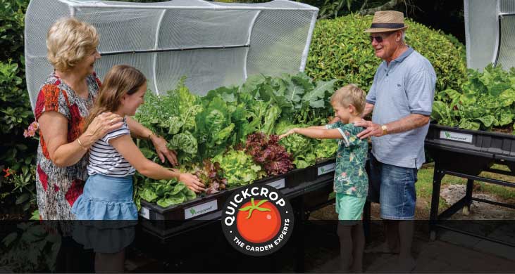a family tending to an open Vegepod planter - header image