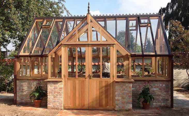 An ornate wooden greenhouse